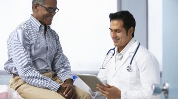African American man consulting with his doctor