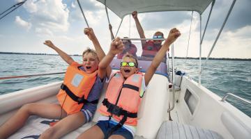 A family happily rides in a boat