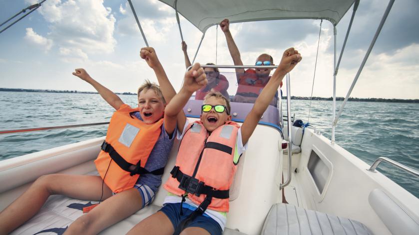 A family happily rides in a boat