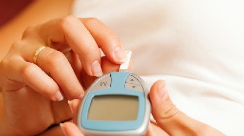 A woman checks her blood sugar