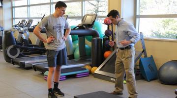 Dan Murray PT works with local athlete Nick Hall on physical therapy
