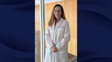 Photo of Alison Gustafson, MD of South Shore Health wearing a white lab coat. Photo is on a navy, wave-patterned background.