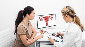 A doctor discusses the results of a gynecologic exam with a patient