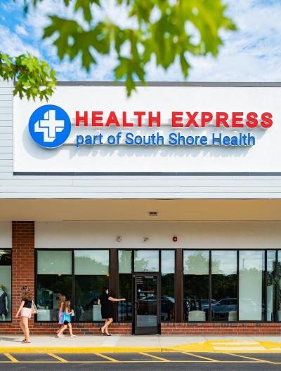 The exterior building and sign for a Health Express urgent care office