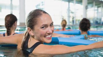 Young woman in pool class