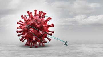 A graphic representation of long COVID with a man tethered to and dragging the spike protein