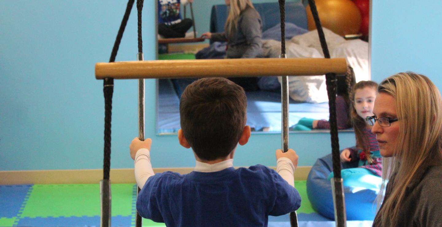 Luke Creedon does occupational therapy with Crystal Cote at South Shore Health