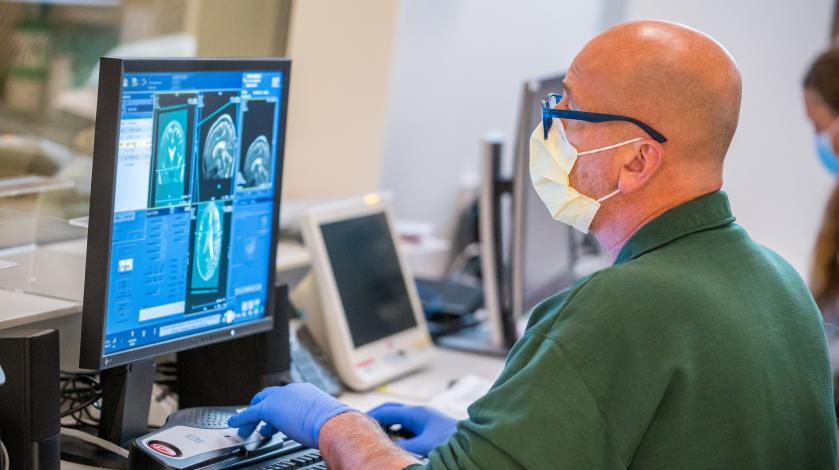 MRI technologist Mark Hanson reviews the scans of a patient in the hospital's new 3T MRI machine.