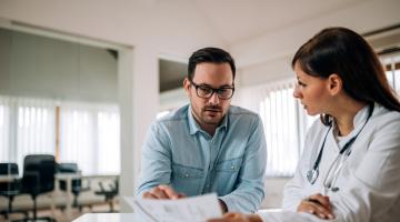A nurse reviews a patient's information