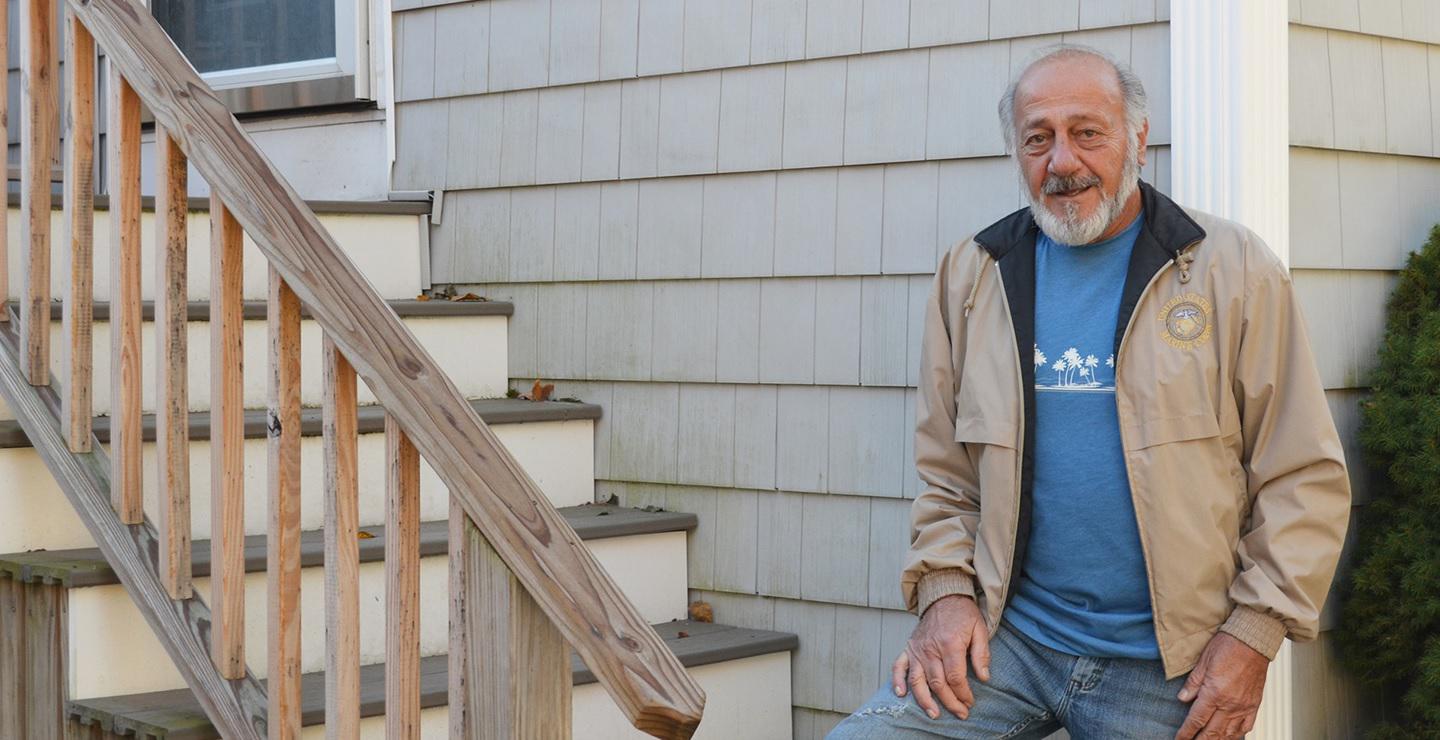 Richard Lalond of Weymouth stands for a portrait in his backyard