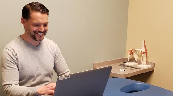 Physical therapist Tim Harrington conducts a virtual therapy visit